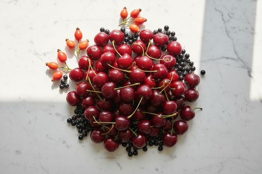 Fresh cherries rosehips and elderberries flat lay - natural whole food sources of Vitamin C